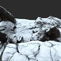 Natural Snowy Mountain Terrain Featuring Rocky Outcrops And Snow Covered Cave