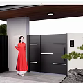 Modern Black Entrance Gate With White Walls Green Plants And Person In Red