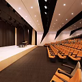 Cultural Center Auditorium Interior Design With Rows Of Seats And Stage Lighting