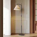 Minimalist Modern Floor Lamp With Soft Light Against Paneled Wall And Wooden Door Frame