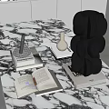 Black Inflatable Decorative Mold With Circular Shapes On Marble Table And Open Book