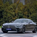 Gray Luxury Mercedes AMG GT Sports Car Parked On Road With Green Trees Background