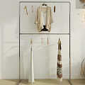 Iron Clothes Rack With Minimalist Design Hanging Clothes Scarves And Clips On White Background