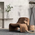 Brown Leisure Chair Paired With Small Rocking Horse Floor Lamp Green Plant On Gray Rug