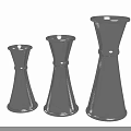 Silver Conical Wine Bottles And Glasses In Three Different Sizes For Elegant Table Decor