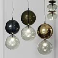 Collection Of Modern Spherical Pendant Lights In Transparent Gold And Dark Brown
