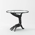 Golden Coffee Table With Artistic Hand Shaped Base And Glass Top