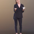 A Woman Wearing Dark Shirt And Dark Pants Holding White Cup And Gesturing With Hand