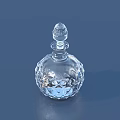 Elegant Transparent Crystal Wine Bottle And Glass With Intricate Carvings On Blue Surface