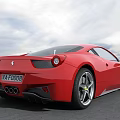 Red Ferrari Sports Car With Sleek Aerodynamic Body And Silver Alloy Wheels