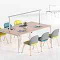 Modern Office Desk Featuring Colorful Chairs Potted Plant And Magazines On Surface