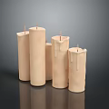 Beige Cylindrical Decorative Candles With Wax Drips On Dark Surface
