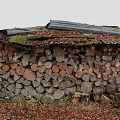 Wooden Logs Stacked Structure With Corrugated Metal Roof And Tree Trunk Surrounded By Fallen Leaves