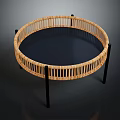 Circular Rattan Equipment Featuring Black Metal Legs And Dark Flat Surface