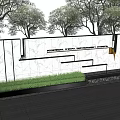 Modern Outdoor Feature Wall With Stone Texture Green Lawn And Surrounding Trees