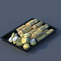 Assorted Delicious Pastries On Black Tray With Long Strips And Round Shapes