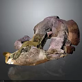 Natural Outdoor Scene With Irregular Colorful Rock Formation And Earthy Textures