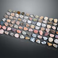 Natural Stone Pebbles In Various Colors And Shapes Arranged On Black Background