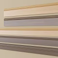 Decorative Wooden Molding Strips In Various Colors On Beige Wall