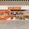 Modern Shopping Mall Restaurant With Orange Counter Wooden Elements Tables Chairs And Green Plants