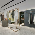 Modern Clothing Store Interior With Clothes on Racks Mannequin in Dress Plants and Display Counter