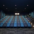 Modern Cinema Interior With Blue Comfortable Seats Arranged In Stepped Rows Under Soft Ceiling Lights 3d model