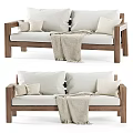 Two Seater Sofa with Wooden Frame Light Colored Cushions and Cozy Throw Blanket