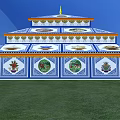 Traditional Multi tiered Religious Building With Blue White Design And Golden Spires On Green Grass