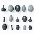 Assorted Ceramic Vessels in Various Shapes and Neutral Gray Tones for Home Decor