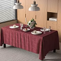 Dining Table With Red Tablecloth Plates Glasses Flower Bouquet Candles And Pendant Lights
