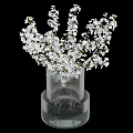Beautiful White Cherry Blossoms Arranged in Ribbed Transparent Vase for Home Decoration