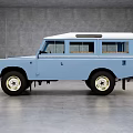 Classic Blue Off Road Vehicle With Vintage Design Roof Windows And White Wall Wheels
