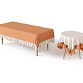 Long Rectangular and Round Dining Tables with Orange and White Ruffled Edge Tablecloths