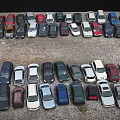 Parking Lot With Various Colored Cars Neatly Arranged In Rows