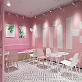 Pink Souffle Dessert Shop Interior With Flower Decorations And White Tables