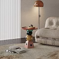 Colorful Modern Side Table With Geometric Stacked Base Holding Cake Tray In Living Room