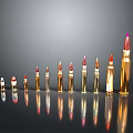 Different Sizes And Colors Bullets Arranged On Black Background With Reflections
