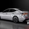 White Modern Sedan Featuring Sleek Body And Alloy Wheels In Reflective Showroom
