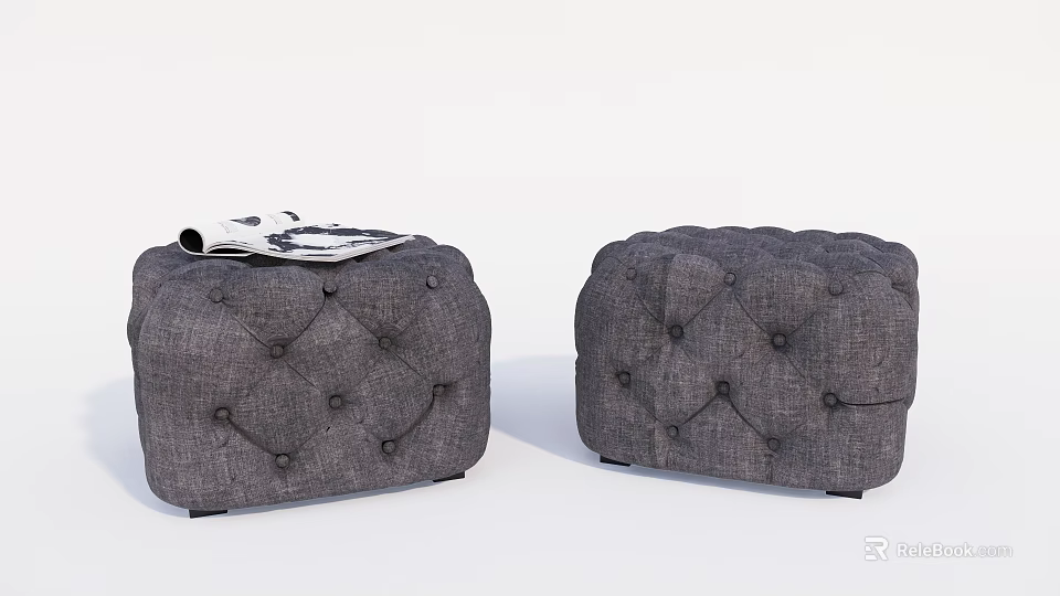 Two Gray Tufted Sofa Stools With Magazine On Top Design 3d model