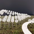 Garden Ornaments Transparent Spherical Decorations Arranged in Arched Shape on Grassland With White Path Alongside
