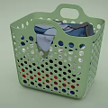 Green Perforated Laundry Basket Holding Colorful Clothes For Everyday Use