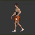 Shirtless Man Walking With Black Basketball Wearing Orange Shorts Against Gray Background