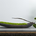Boat Shaped Garden Ornament With Green Moss And Trimmed Pine Tree On Stone Platform