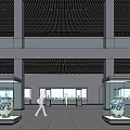 Spacious Cultural Center Interior With Glass Display Cases Columns And Exhibits