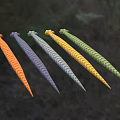 Five Different Colored Reptile Snakes Green Yellow Gray Dark Blue Orange on Grass Background