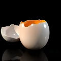 Cracked Eggshell With Yellow Yolk On Black Background For Food
