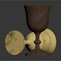 Shiny Gold And Brown Metal Cups One Tilted One Standing On Dark Background