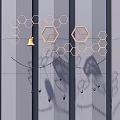 Gray Wall Decor With Golden Hexagons And Bell Hanging Decorations And Shadows