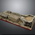 Handmade Wood and Stone Craft Pieces with Rough Surfaces on Red Display Base