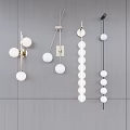 Modern Interior Design With White Globe Metal Frame Wall Sconces On Gray Wall 3d model
